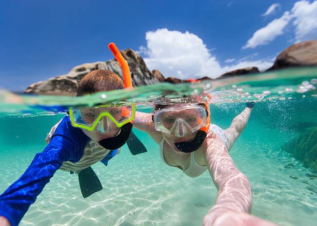 Michelle and her brother enjoying a snorkeling time in El Cielo.