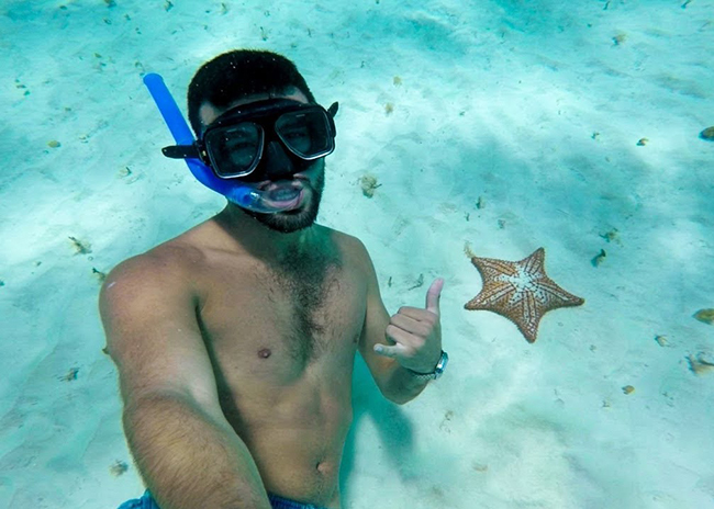 Paul amazed by a starfish he found snorkeling in El Cielo Cozumel.